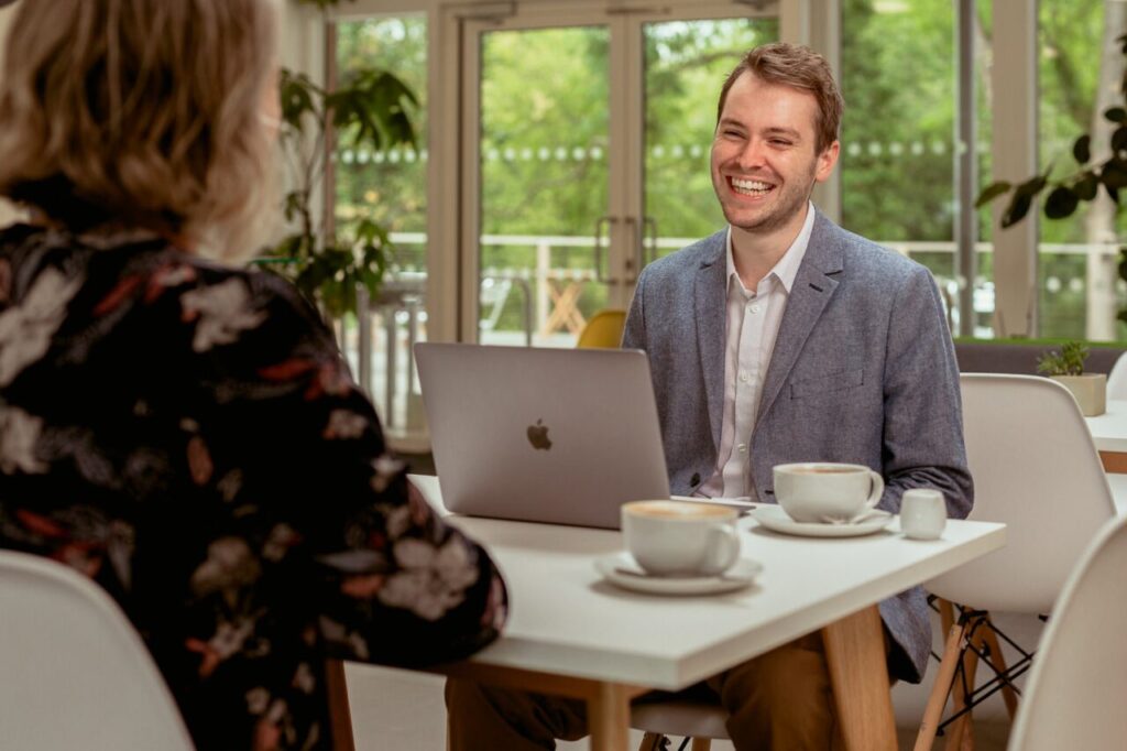 Josh Cox meeting a client over coffee in Didcot
