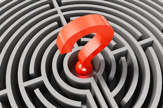 A red question mark at the centre of a maze